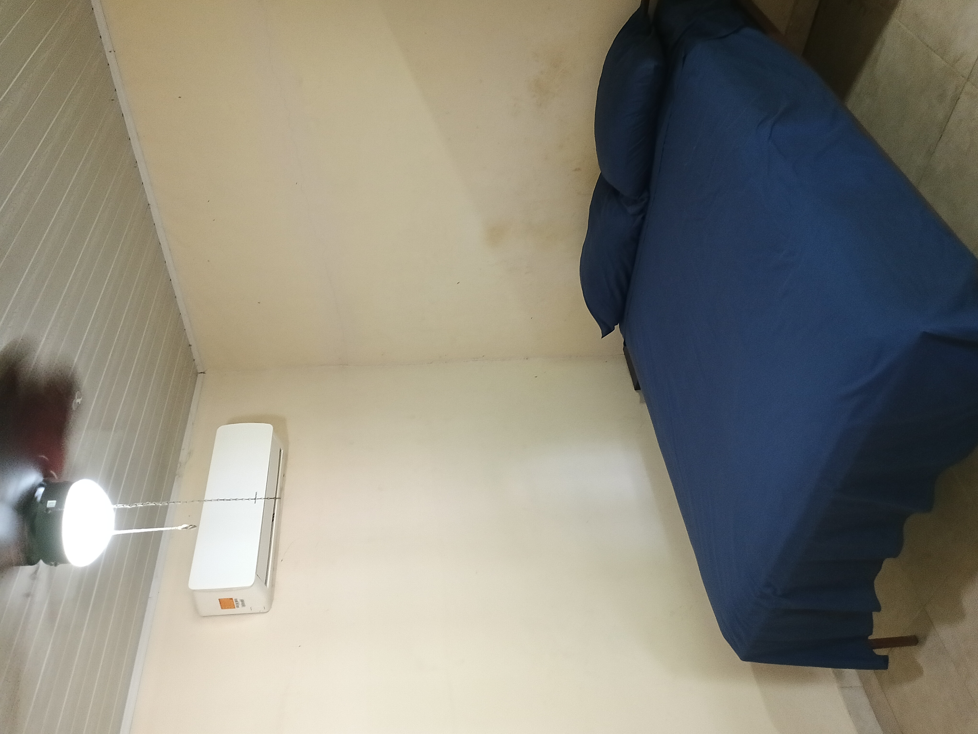 Bedroom with AC and ceiling fan