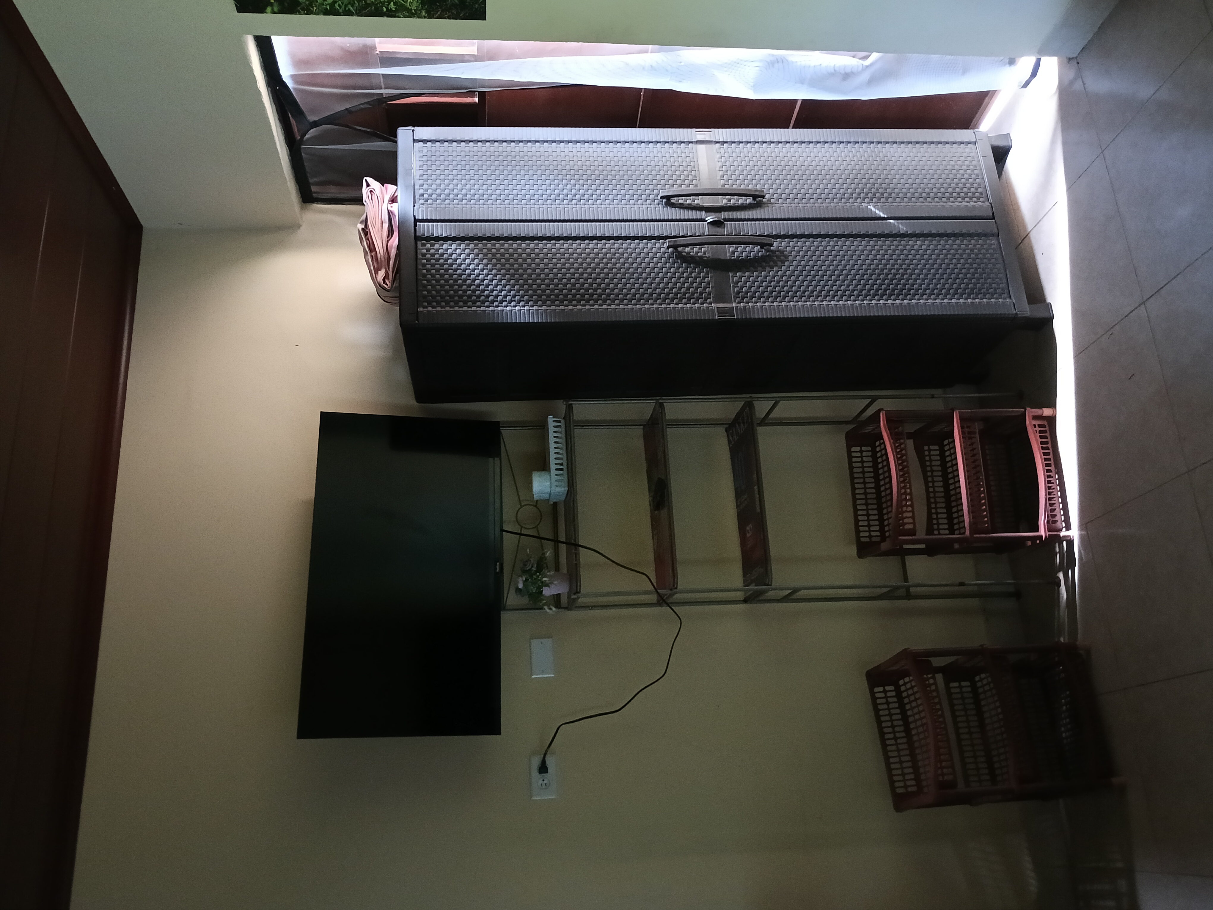 Living area with TV and wardrobe