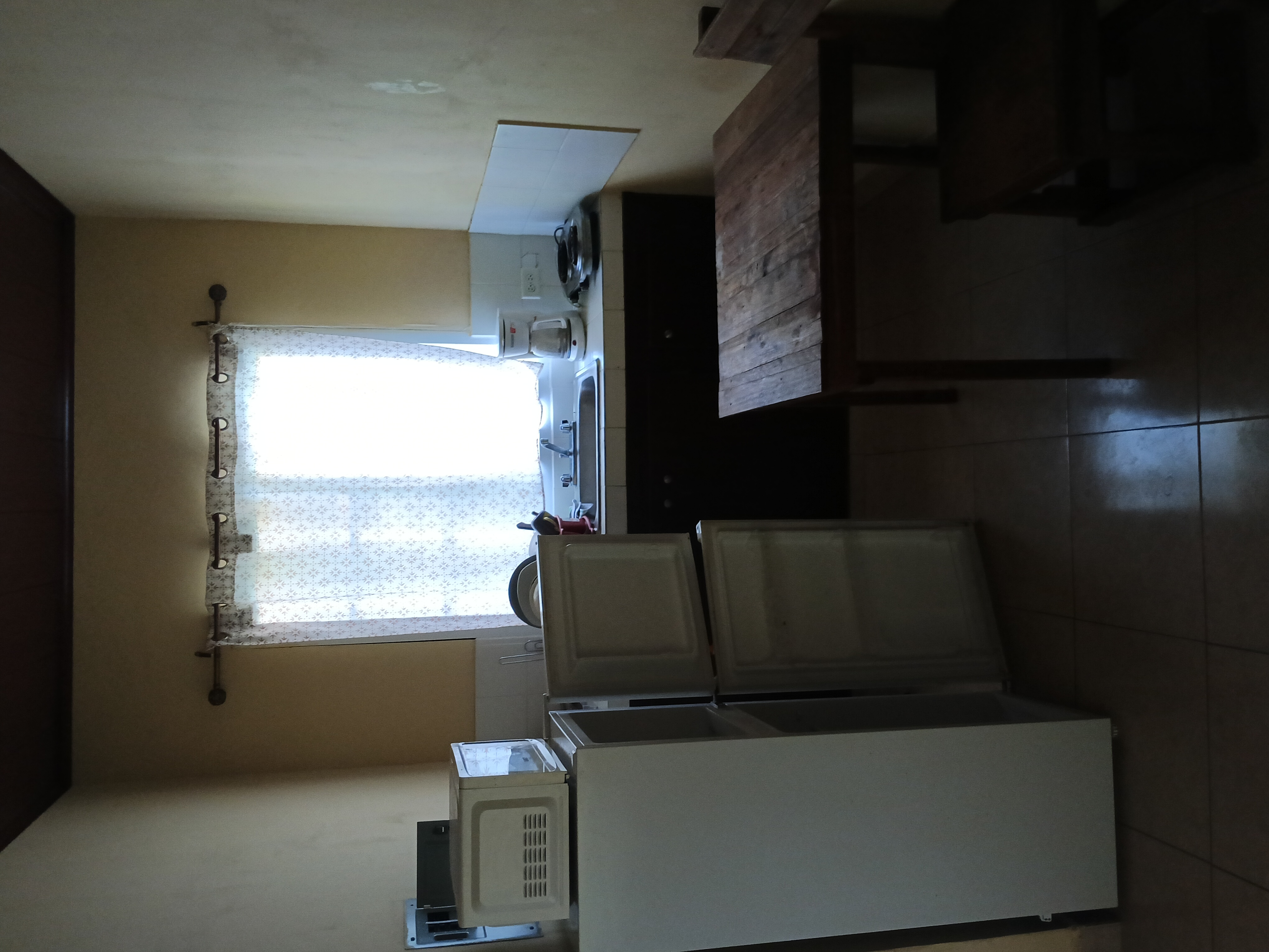 Kitchen with fridge and microwave